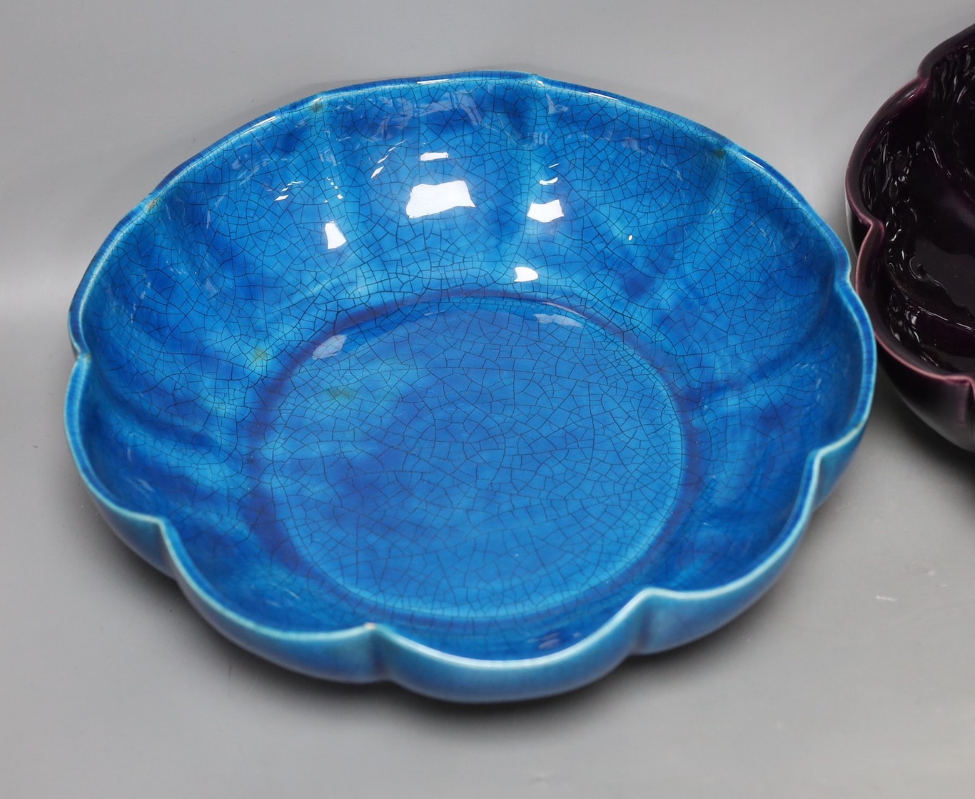 A Chinese blue crackle-glaze fluted bowl, together with another similar in purple. 28cm diameter